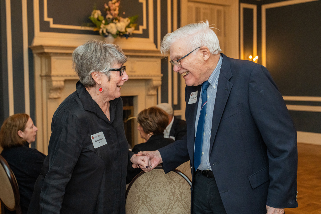 Pam Ploetz and George Zografi speak together