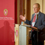 An award winner speaks at the Merit Award Celebration