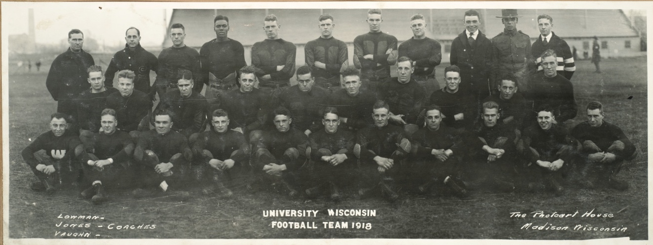 1918 UW Varsity football team poses together with Coaches Lowman, Jones, and Vaughn.