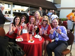 Beth Martin, associate professor (CHS) in the Pharmacy Practice Division, (second from right) proudly displayed her Badger pride with students and alumni.