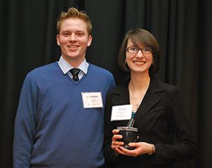 L-R: Christian Holm, DPH-2, President of the Wisconsin Society of Pharmacy Students presents the Pharmacy Society of Wisconsin Student Good Government Award to Rebecca Grupe, DPH-2.
