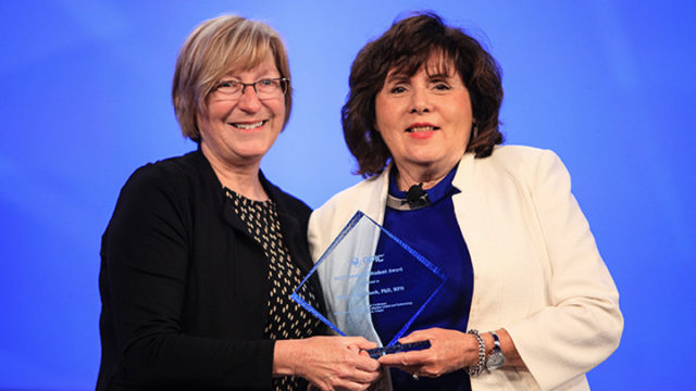 photo of Mary Jo Knobloch receiving award