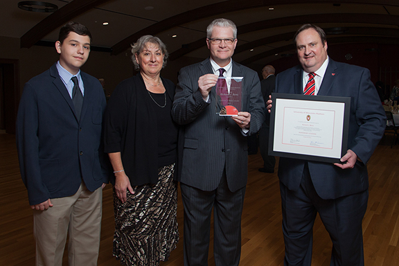 Citation recipient Richard Bertz (second from right) with his son, wife, and Dean Steve Swanson (right)