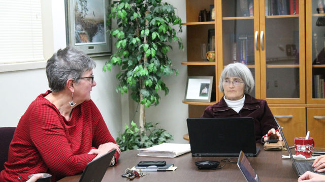 Connie Kraus and Mara Kieser at table during meeting