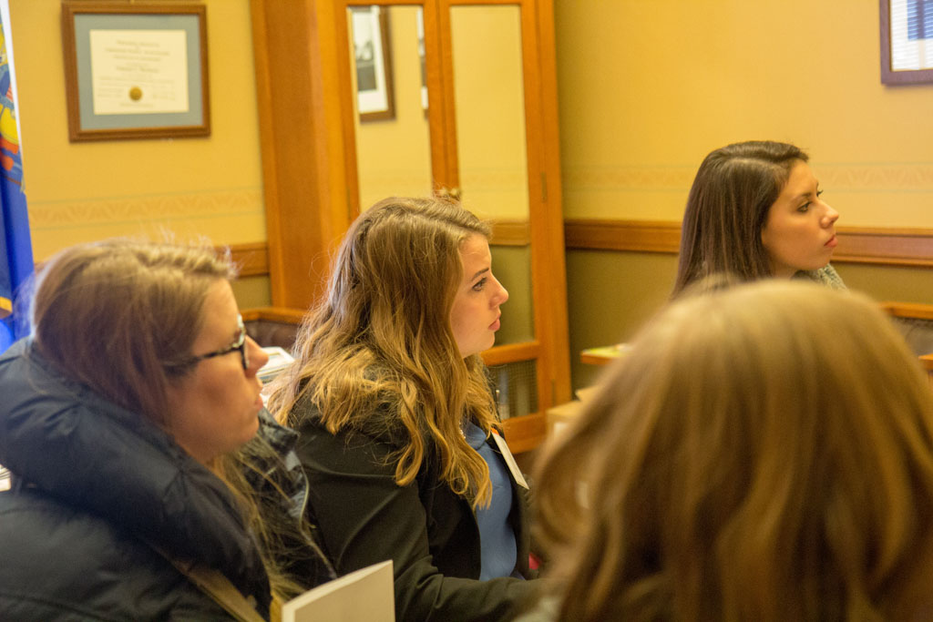Pharmacy students paying attention to speaker in office