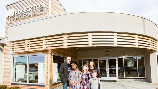 The Gresens standing in front of Edgerton Pharmacy