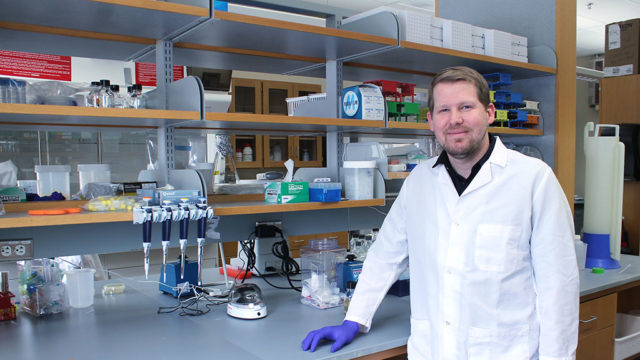 Jason Peters standing at a lab counter