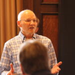 Professor Ron Burnette addressing the School of Pharmacy's faculty and staff.