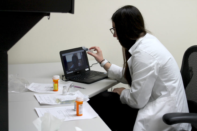 A PharmD student completing the telepharmacy simulation.