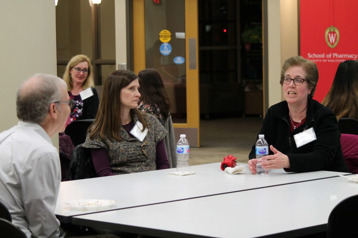 Gretchen Wagner speaking to other health professionals at a table