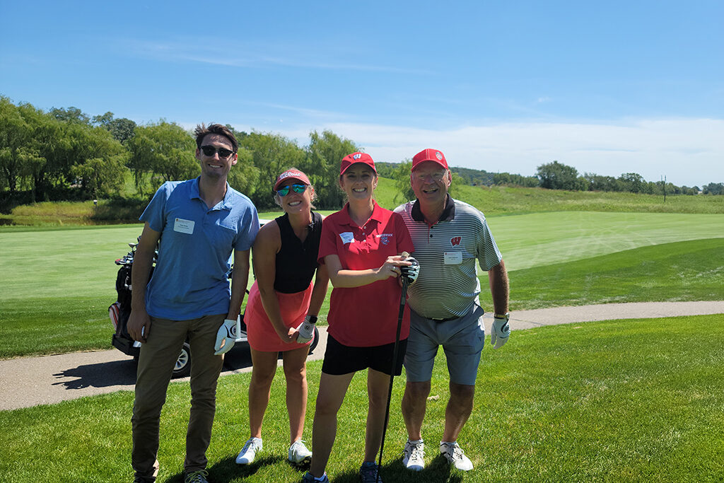 Pharm Alumni together in golf gear