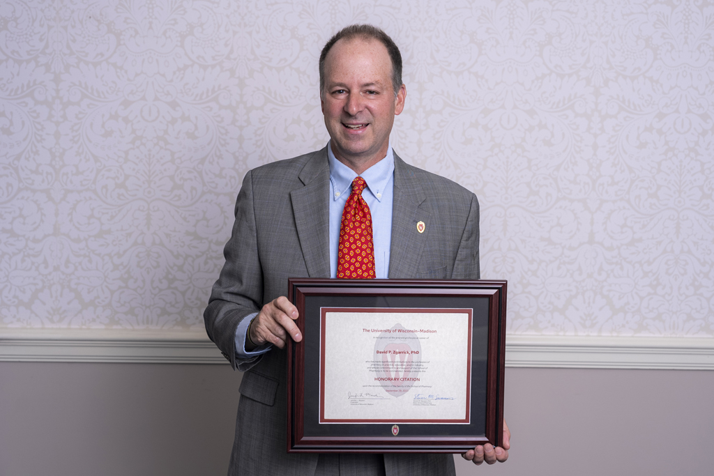Dave Zgarrick poses with his 2023 Citation of Merit award.