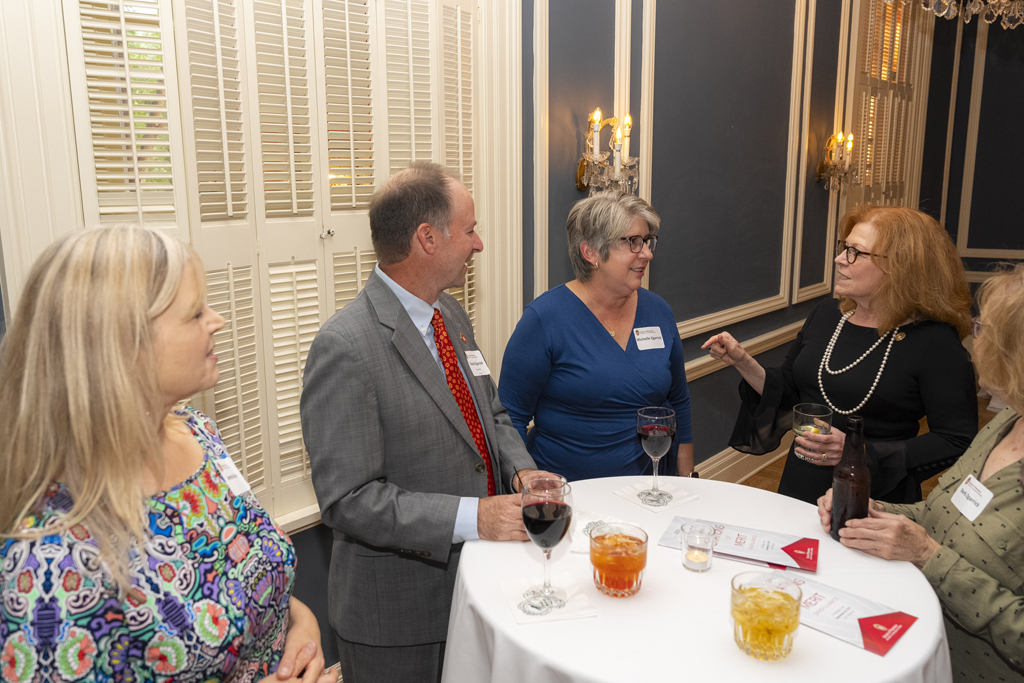 Kathy Skibinski, Dave Zgarrick and three other attendees gather at a table