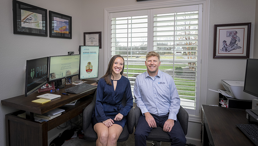 Jesse and Jessica Schaetzel pose in their home office