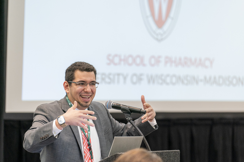 Ed Portillo speaks into a microphone at a podium