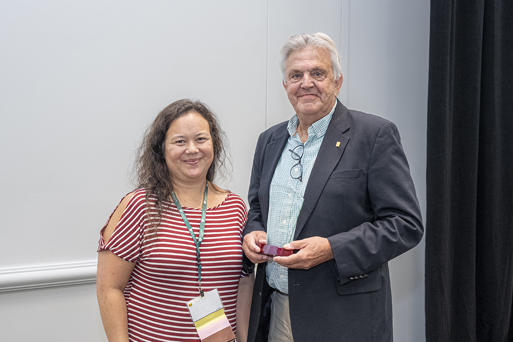 Terry Maves poses with Julie Bartell and his trophy