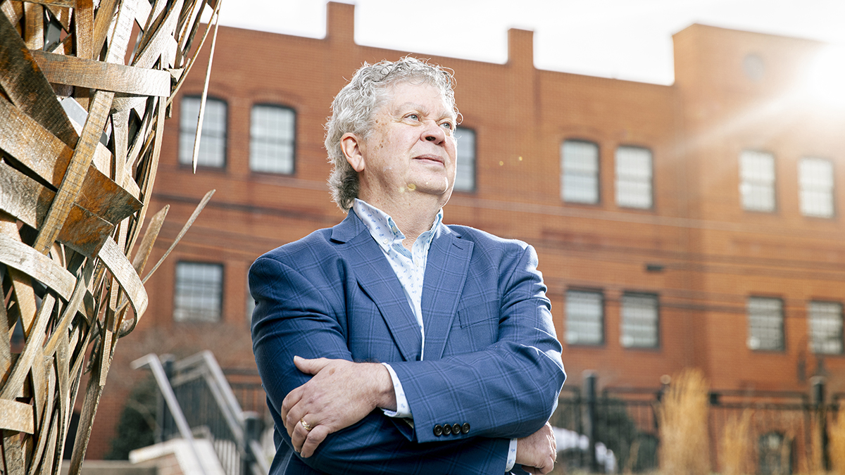 Elliott Sogol portrait in front of a brick building