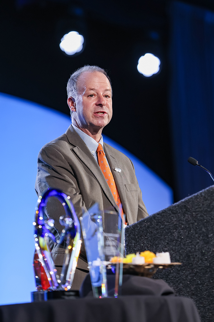 Dave Zgarrick speaks at a podium