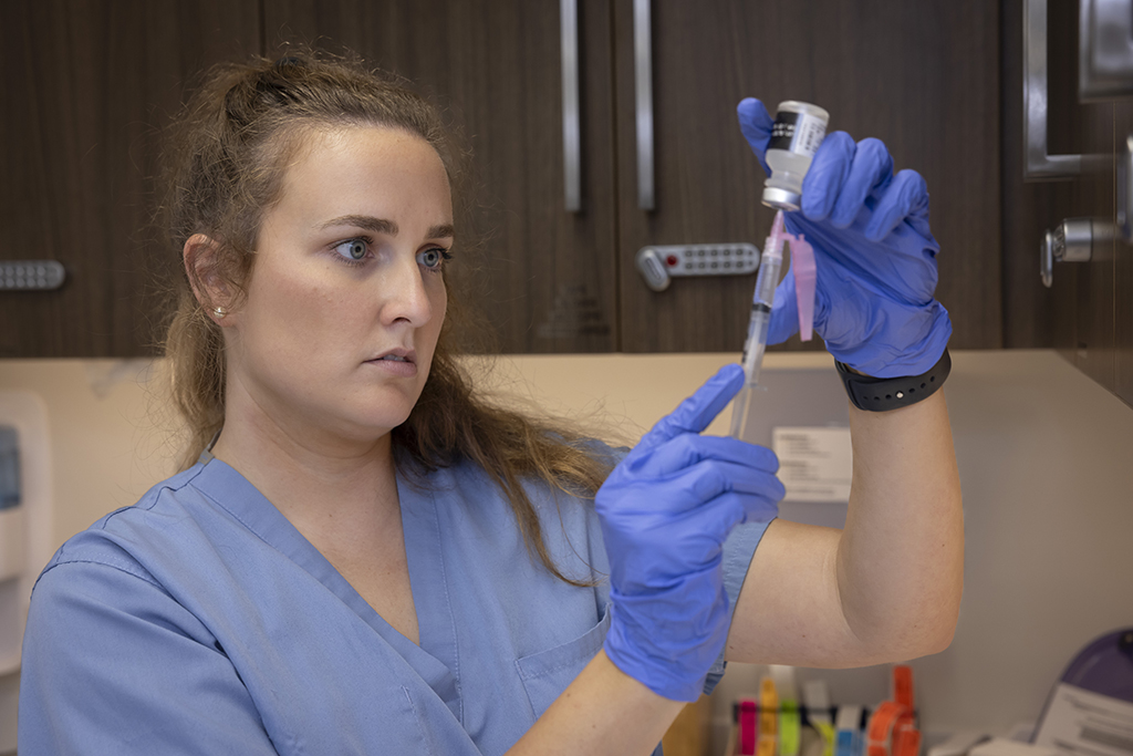 Lindsey Hoff drawing up a dose of vaccine