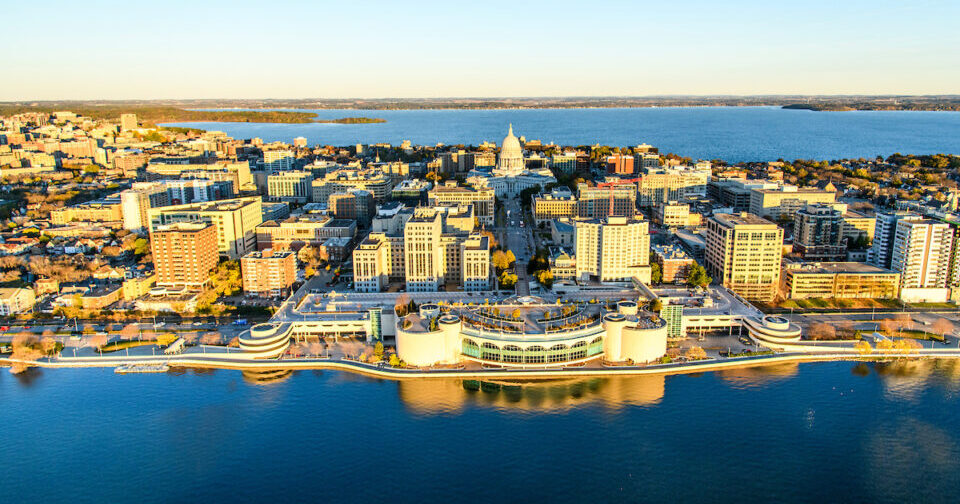stunning aerial view of Monona Terrace and downtown Madison with the state capital on the shore of Lake Monona
