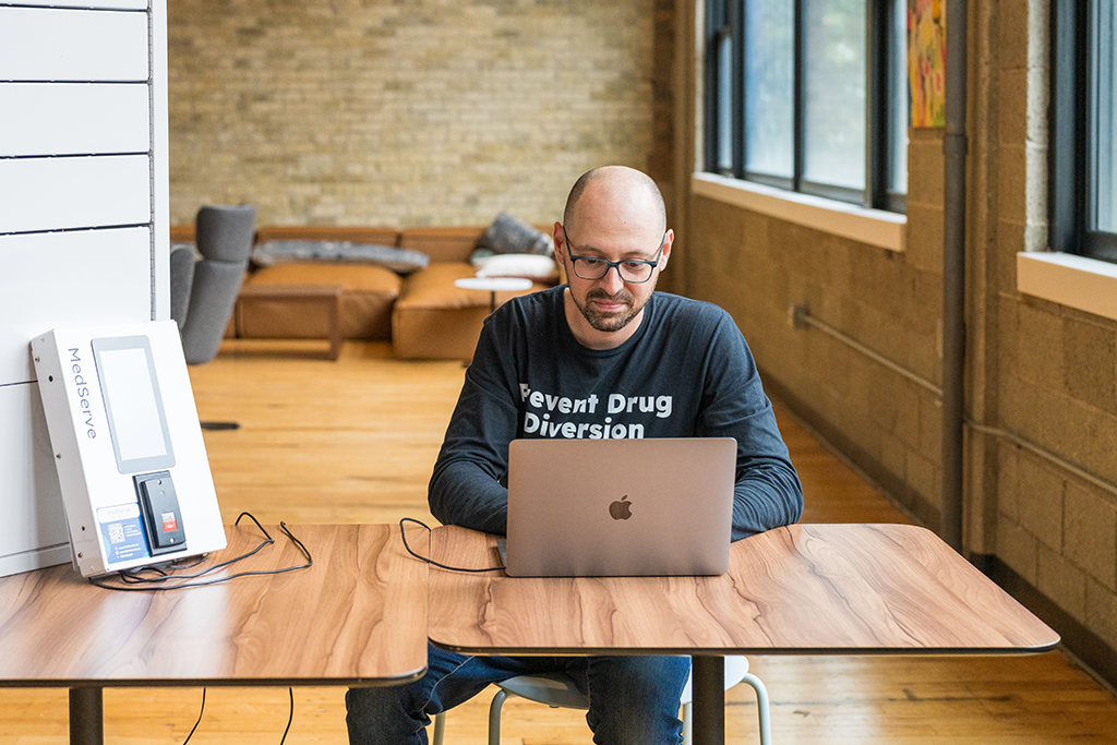 Alex Yampolsky works on his laptop 