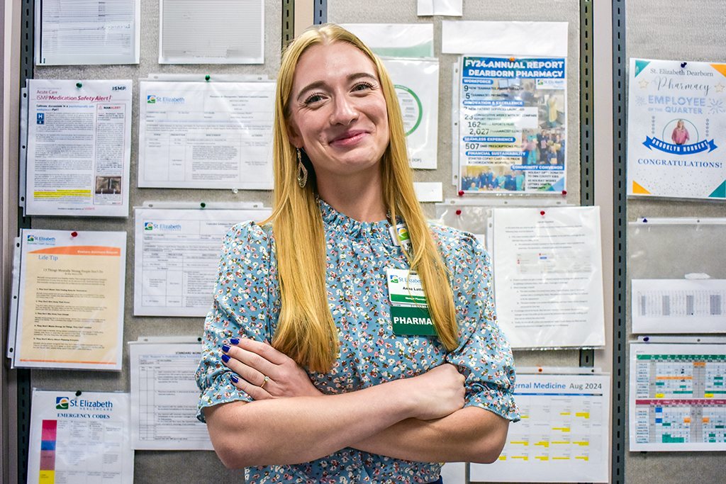 Anna Lattos smiles in the pharmacy