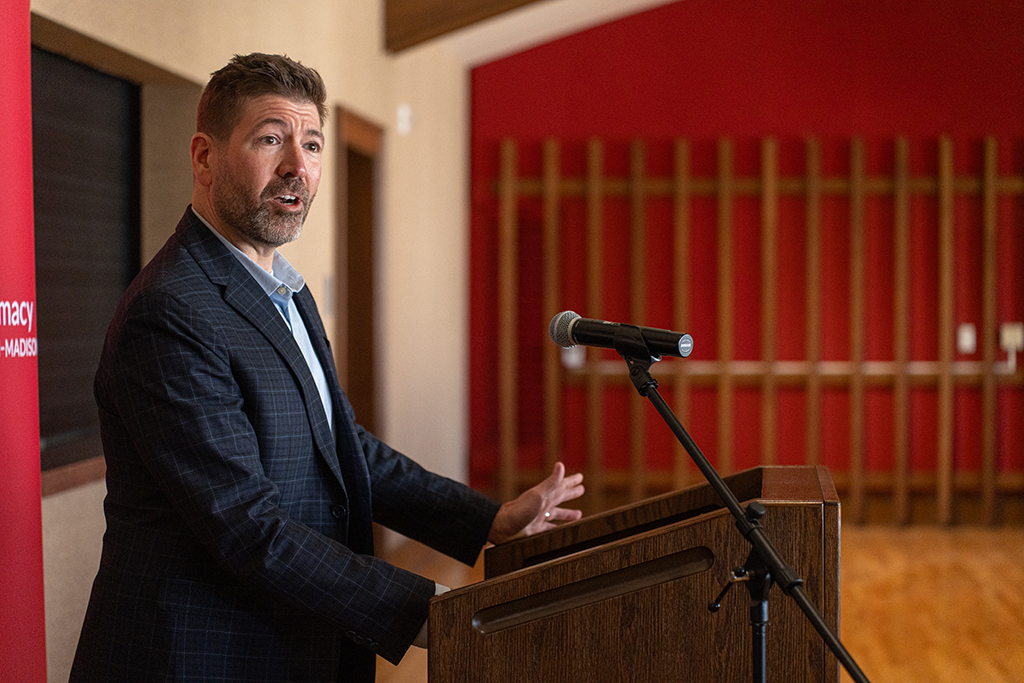 Ben White speaks at a podium