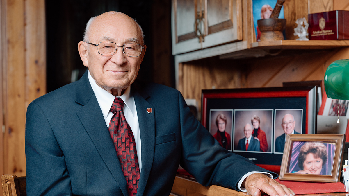 David Zilz portrait next to photos of his late wife, MaryAnn
