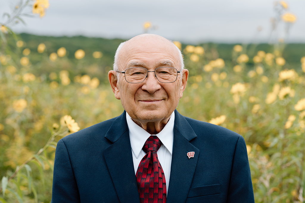 David Zilz portrait outside near flowers