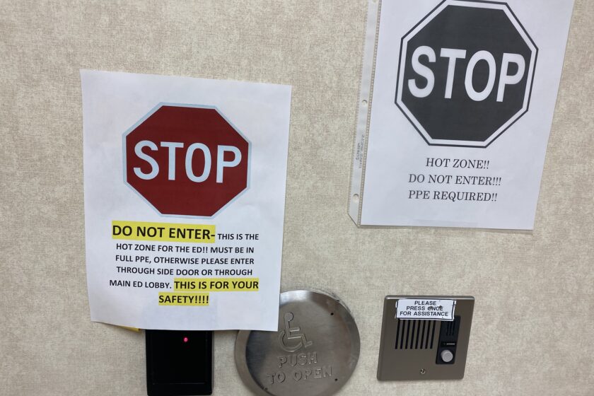 Signs marking the "hot zone" of the emergency department.