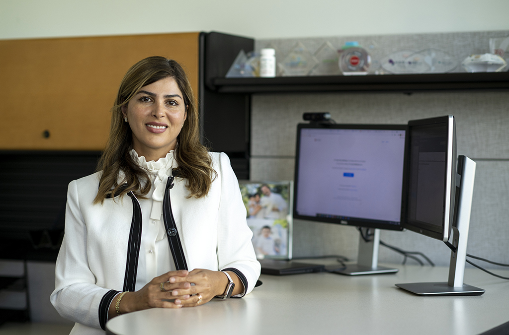 Elham Nejati sits at her desk at Gilead
