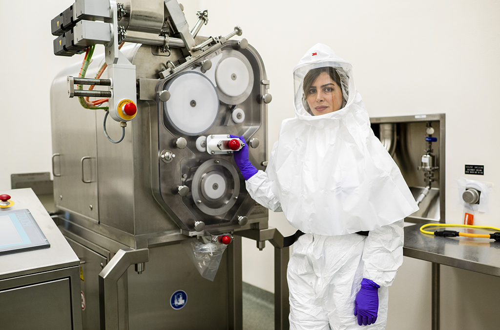 Elham Nejati in full PPE in a Gilead lab