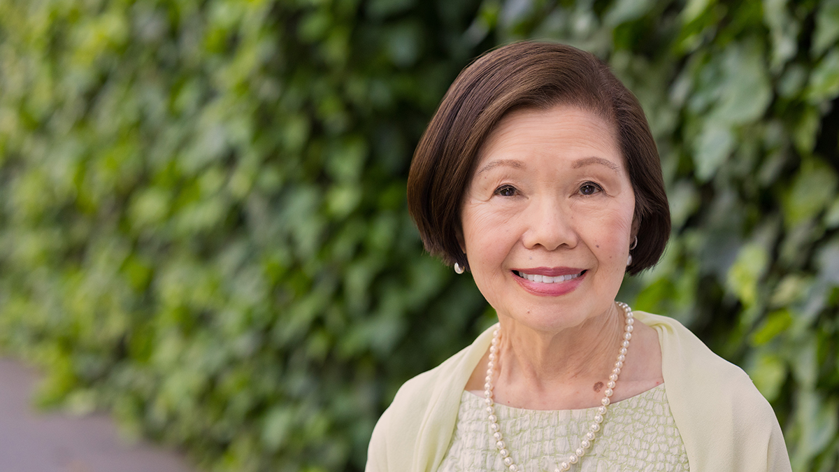 Pauline Chan portrait outside in front of greenery