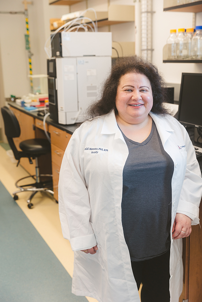 Heidi Mansour smiles in her lab