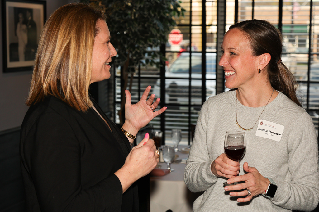 Jessica Schaetzel and Melissa Theesfeld smile in conversation