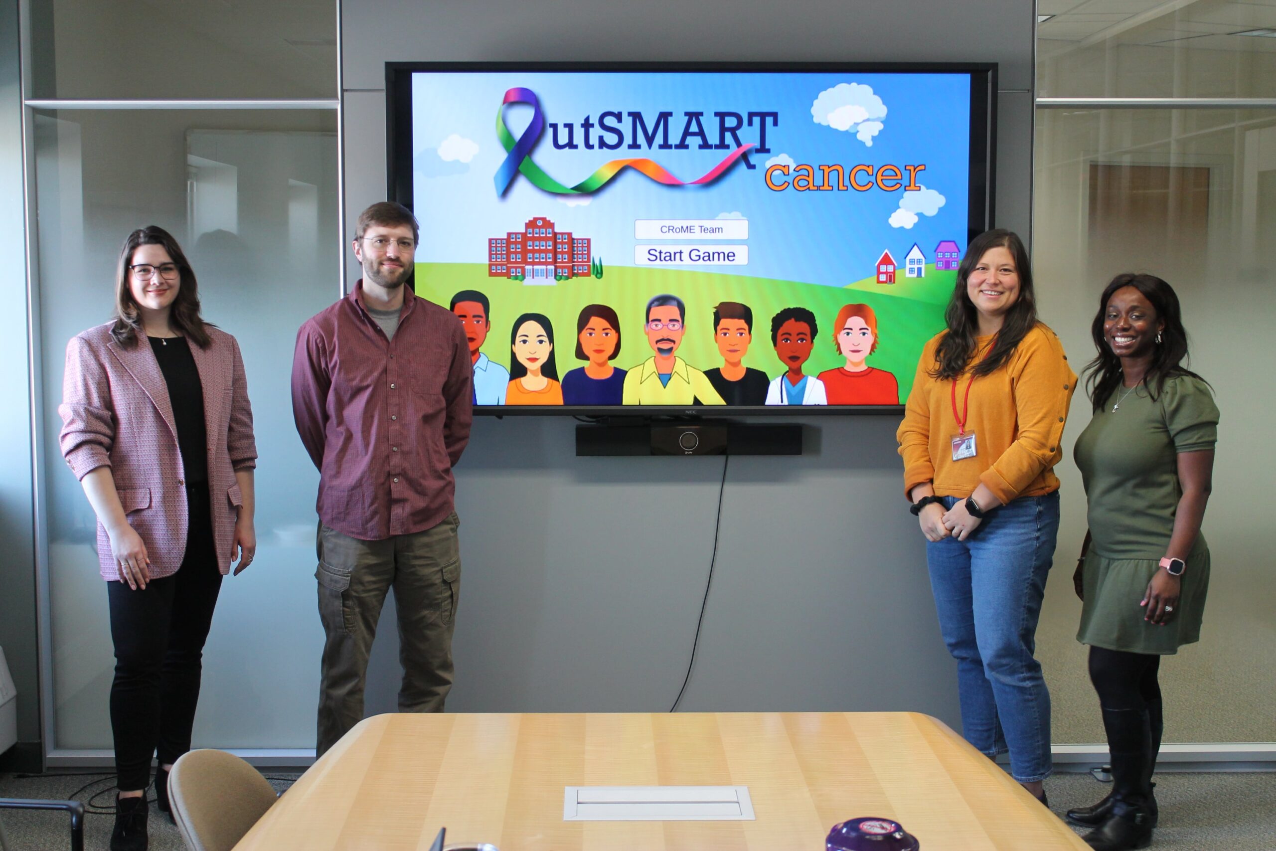 CRoME Team members with OutSMART Cancer game