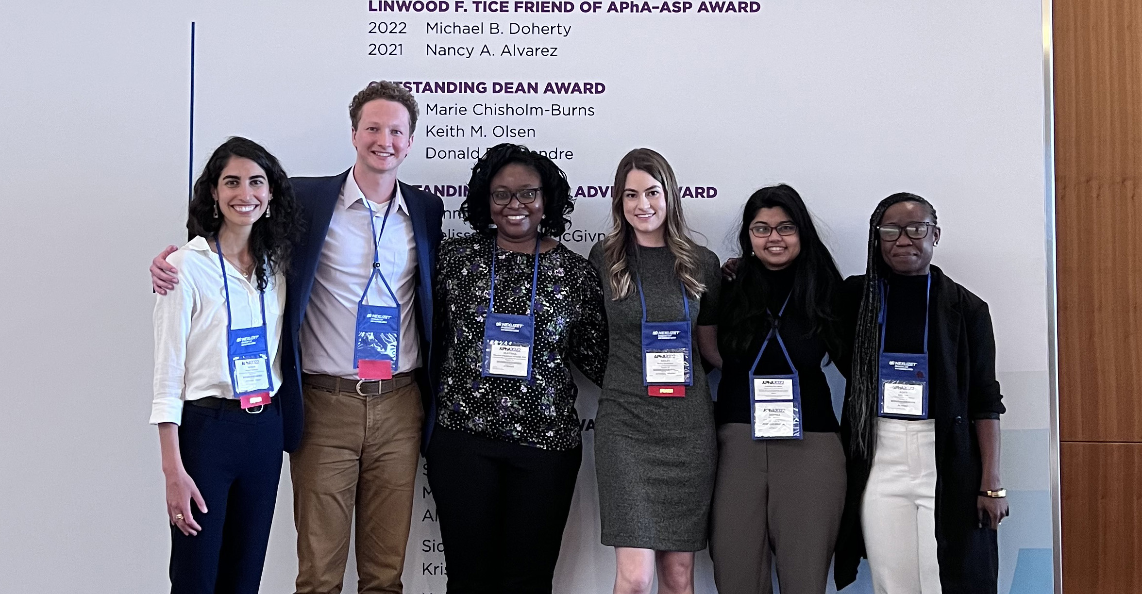 PharmD students Nassim Nassim Sarkarati and Luke Schwerer, Associate Professor Olayinka Shiyanbola, PharmD student Bailey Stevenson, and Health Services Research in Pharmacy graduate students Deepika Rao and Adati Tarfa at the 2022 American Pharmacists Association Annual Meeting.