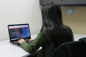 A student at her laptop