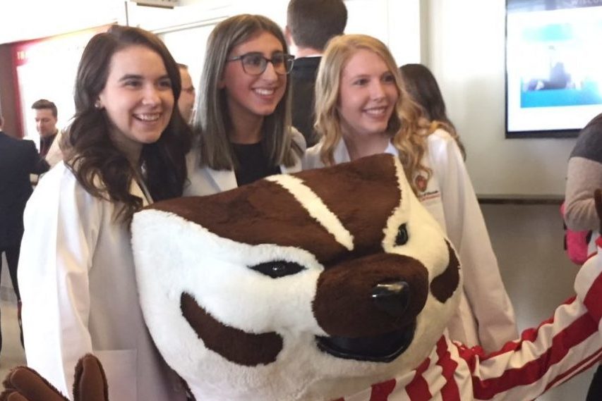 Students celebrate the moment with Bucky.