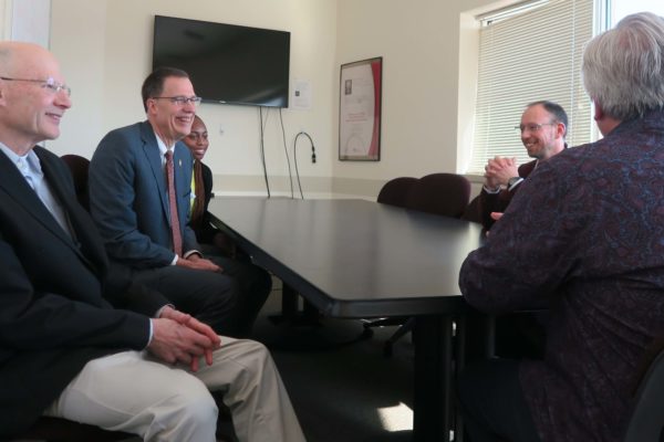Provost Karl Scholz smiling during a meeting with SoP staff