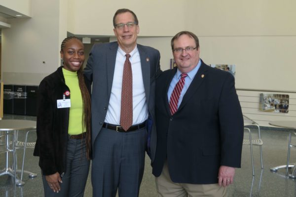 Cierra Brewer, Provost Karl Scholz, and Steve Swanson together arm-in-arm