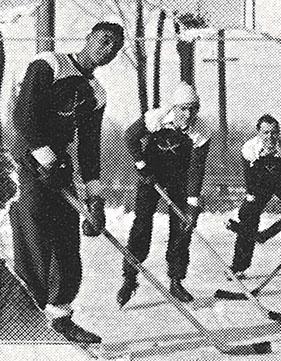 James Buchanan on the ice playing hockey with high school teammates