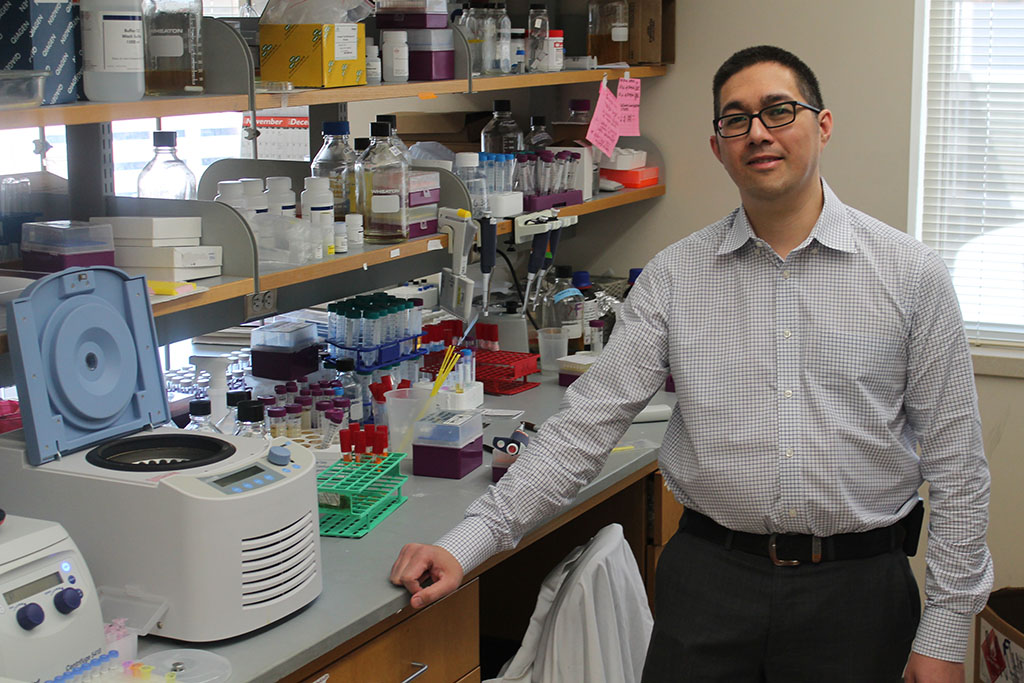Jason Kwan at his lab counter