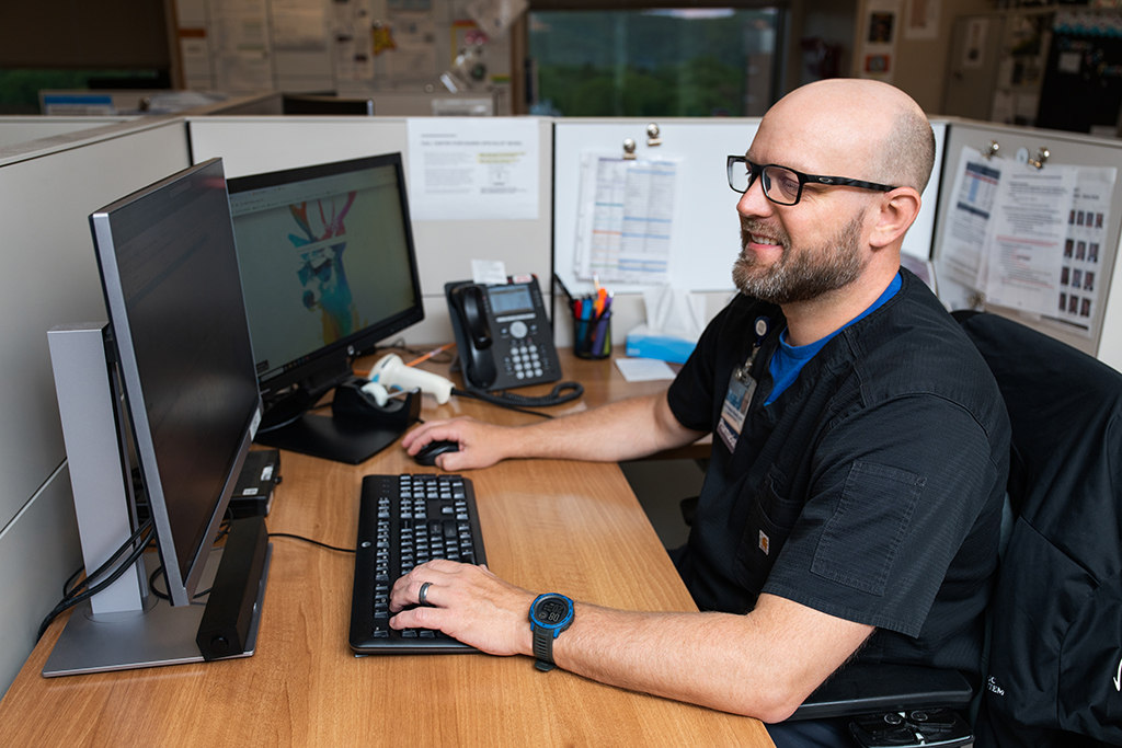 Nathan Woolever works at a computer