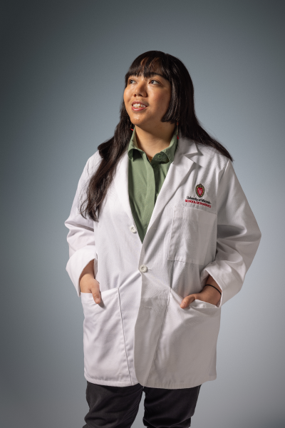 PharmD student Nuelle wearing a white coat