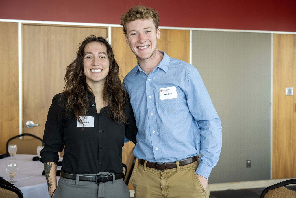 Sean Moran smiling arm-in-arm with Shelli Kayser