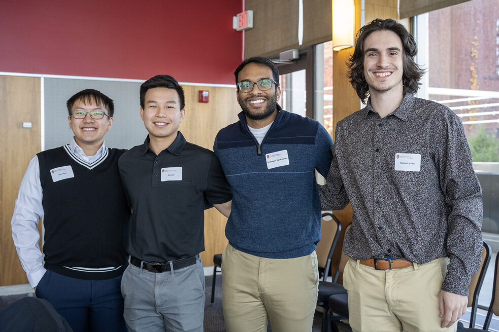 Lucas Thao, Alex Lai, Mathawan Balakrishinan, and Michael Milano standing arm-in-arm with ascending heights