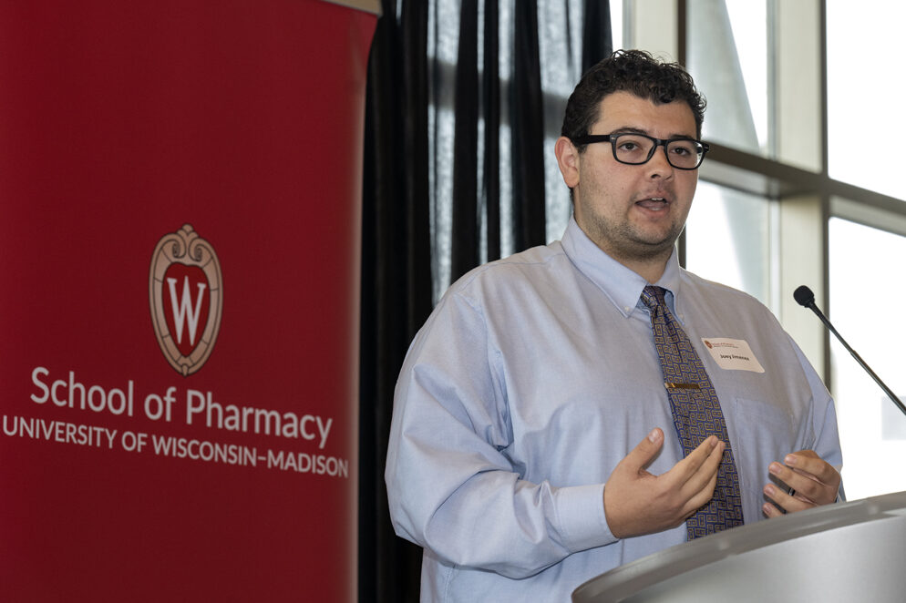 PharmD student Joey Jimenez speaks at the microphone.