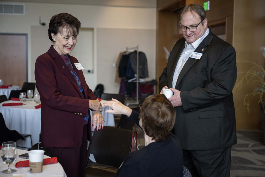 Dean Steve Swanson speaks with Peggy Wiederholt.