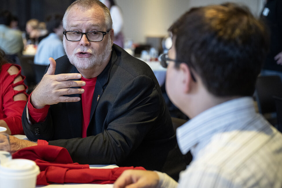 Donor Scott Hanna speaks with a PharmD student.